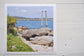 Pinch River unframed 17cm x 17cm Photographic Print on Paper Titled: Reids Reserve #1. The subject of the print is a coastal rocky outcrop looking out over the ocean, with mooring posts in the background looking towards the lake's entrance. Top view.