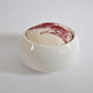 Pinch River ceramic pin cushion featuring Wattle Bird print in Wine Berry (colourway 1). Side view.