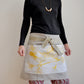 Model wearing Pinch River waist apron / half apron No. 4 with pockets, against a plain background. Front View. Pose #2