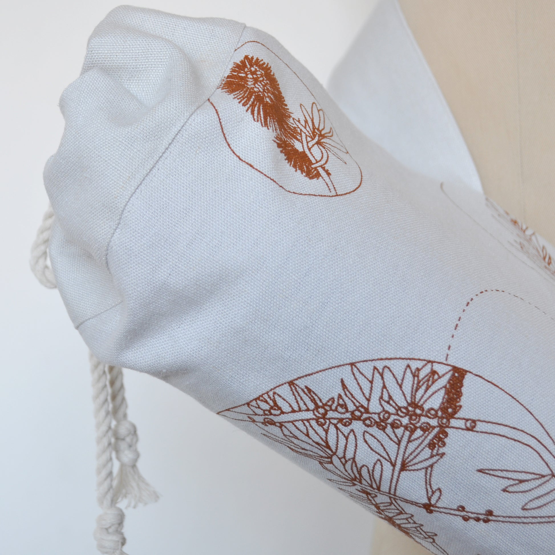 Pinch River yoga mat bag in Wattle Bird in the Bottle Brush print in Burnt Orange on Silver Ash (colourway 2). Detail view.