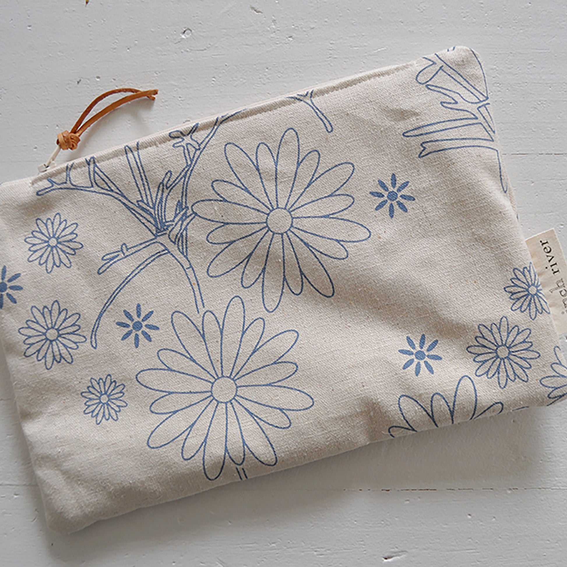 Pinch River zipper pouch featuring Brachycomb print in Horizon Blue (colourway 1). Top view.