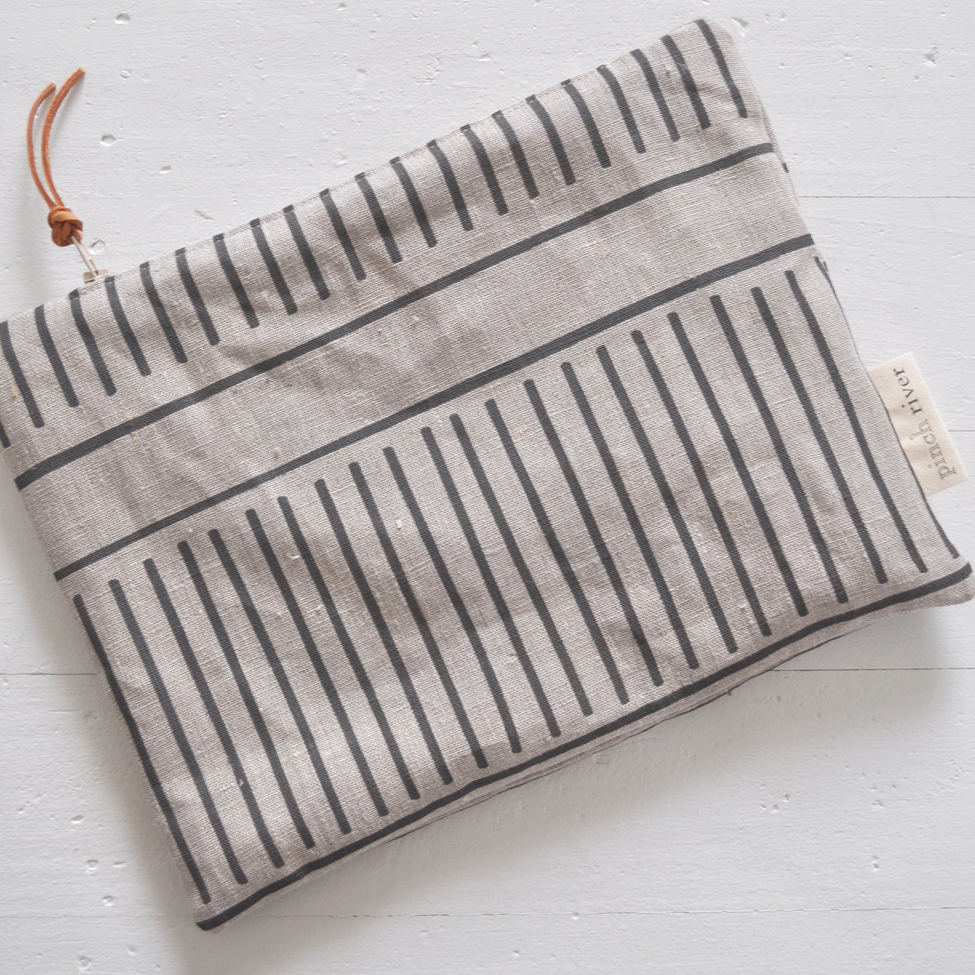 Pinch River zipper pouch featuring Corduroy Pathway print in Gey Bark (colourway 2). Top view.