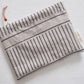 Pinch River zipper pouch featuring Corduroy Pathway print in Gey Bark (colourway 2). Top view.