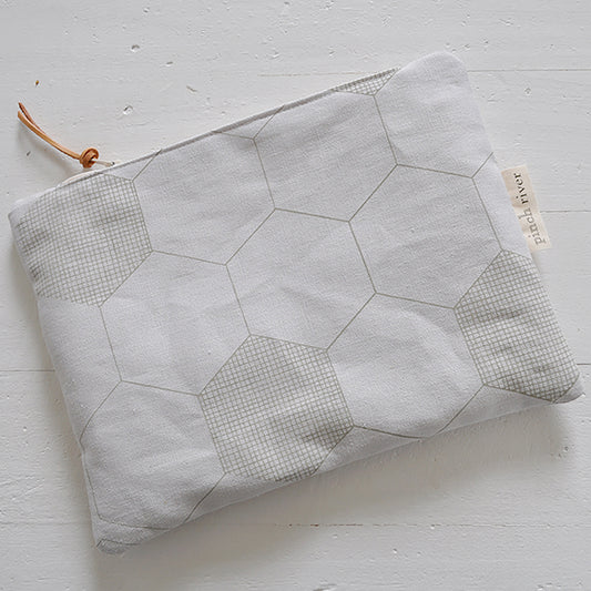 Pinch River zipper pouch featuring Honeycomb print in Moss Green (colourway 1). Top view.