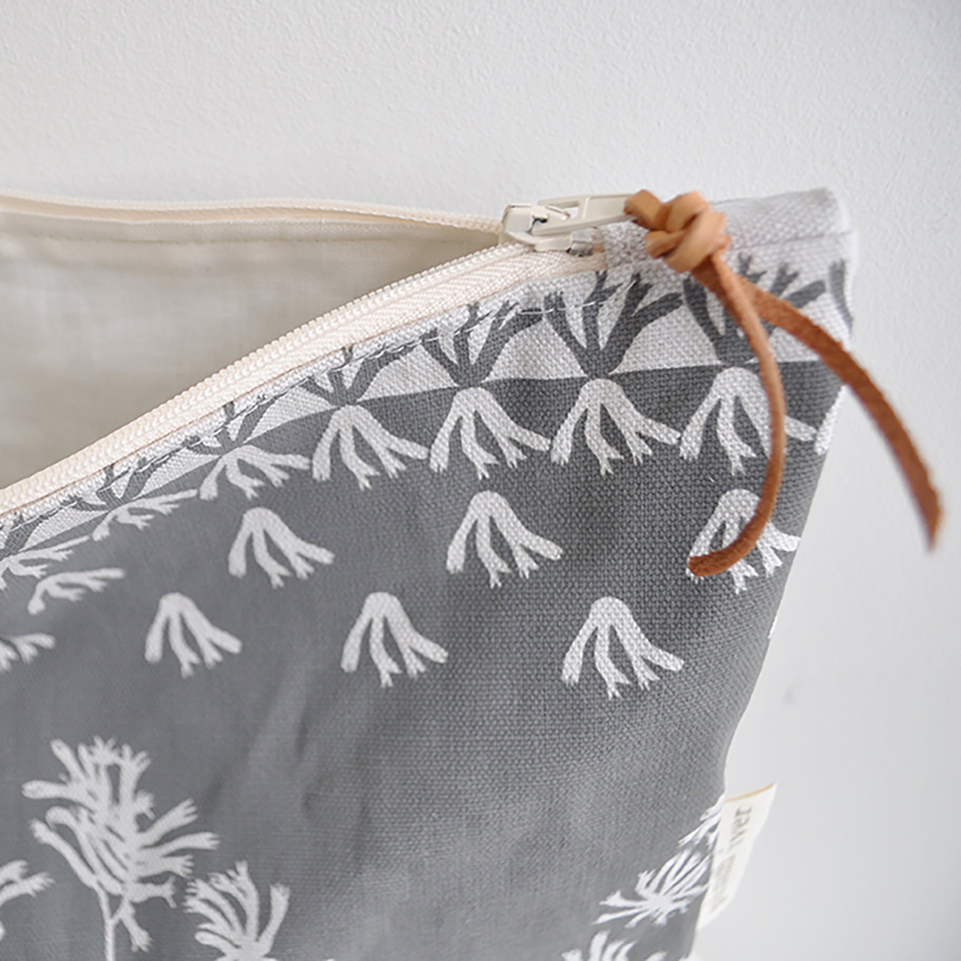 Pinch River zipper pouch featuring Kangaroo Paw print in Tempest (colourway 3_v2). Side view with zipper opened to show the pouch is fully lined.