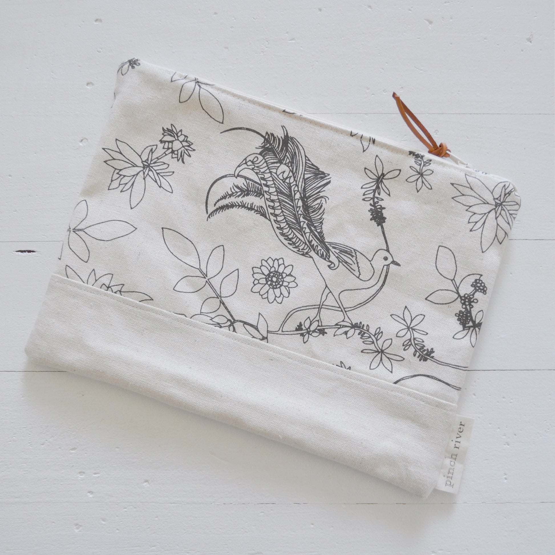 Pinch River zipper pouch featuring Lyrebird print in Gey Bark (colourway 1). Top view.